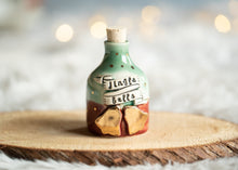 Load image into Gallery viewer, Jingle Bells in a bottle with gold accents